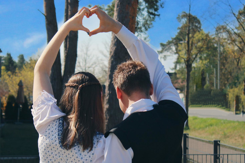 Lilo and Mike making a <3 with their hands
