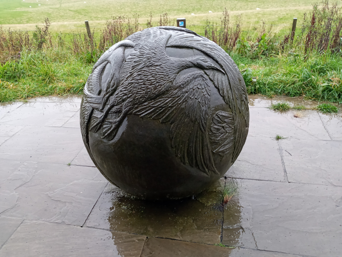Stone ball with bird engravings