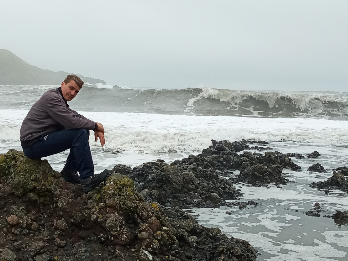 Mike sitting on rocks